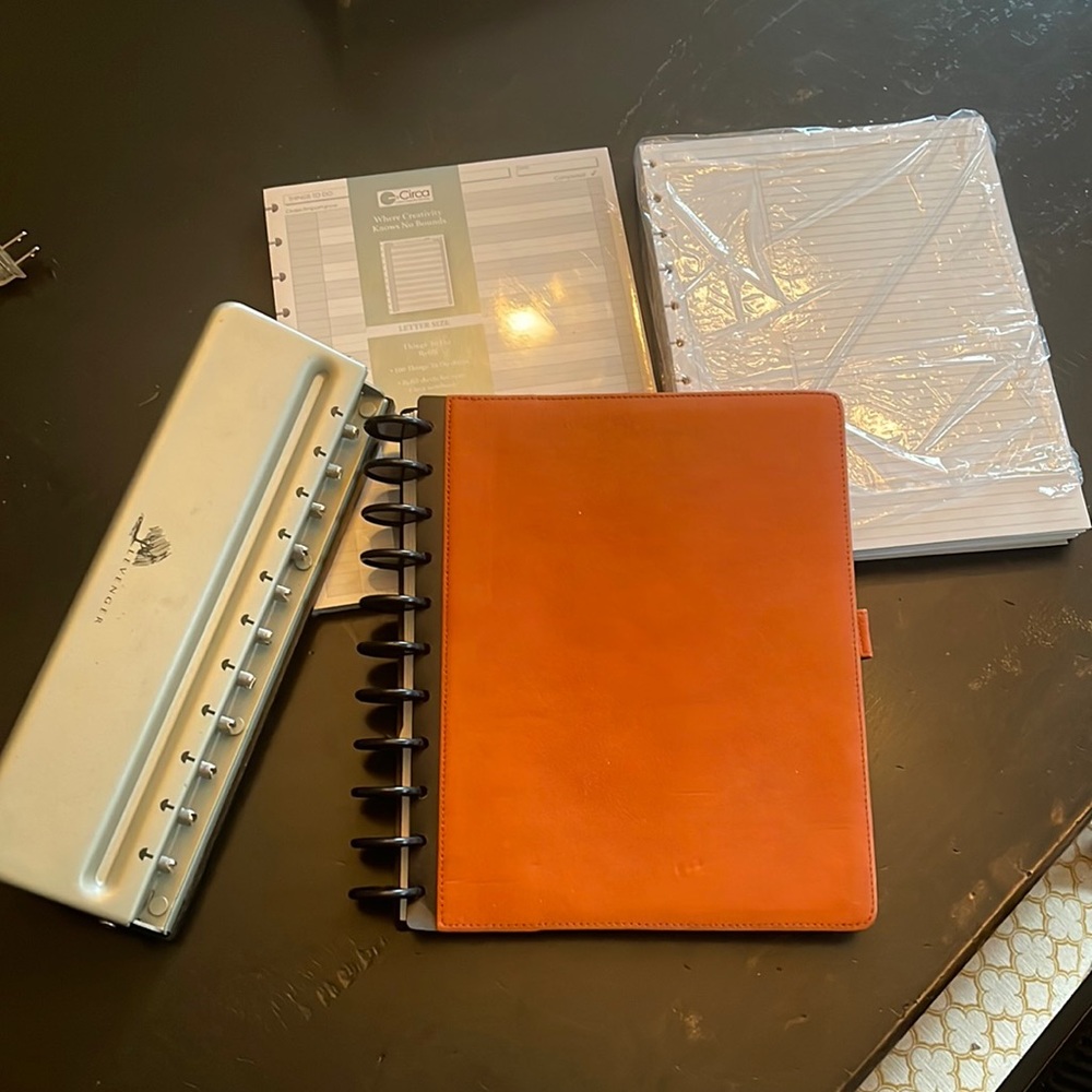 Levenger lot includes whole puncher and leather letter size portfolio